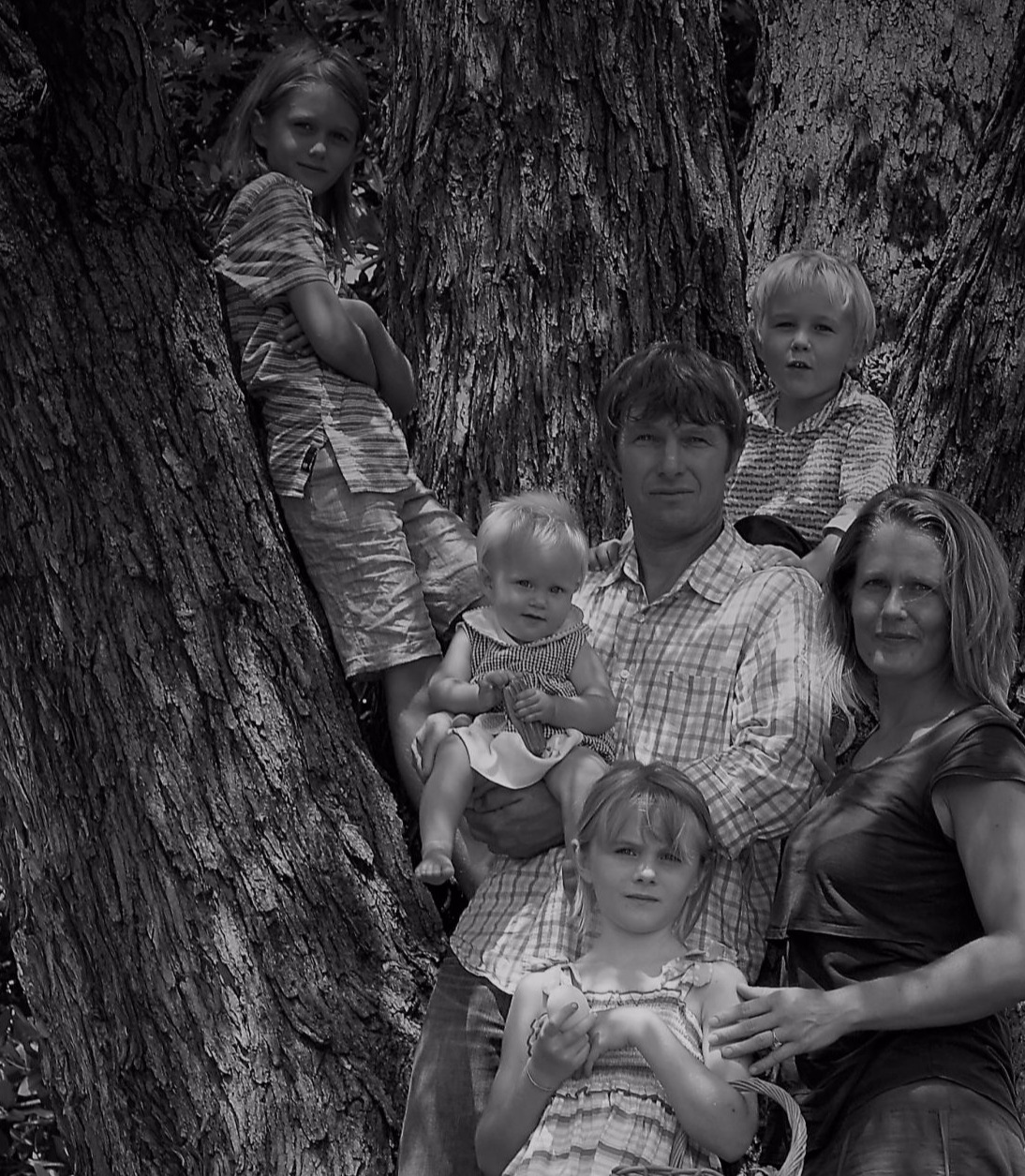 Black and White family picture taken in front of a huge old silver maple in 2018